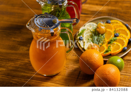 fruit and berry lemonades on the wooden tray with spruce. 84132088