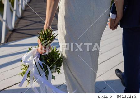 This is wedding bouquet at bride's hands. This is wedding bouquet at bride's hands. 84132235