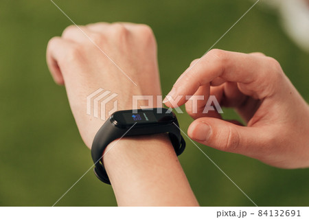 Girl Checks Heartbeat On Smart Watch After Fitness. 84132691