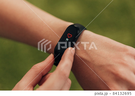 Smart watch on the hand. Measuring heart rate. Smart watch on the hand. Measuring heart rate. 84132695