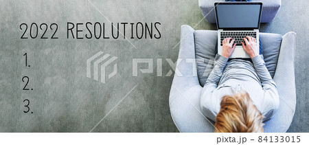2022 Resolutions with man using a laptop 2022 Resolutions with man using a laptop 84133015