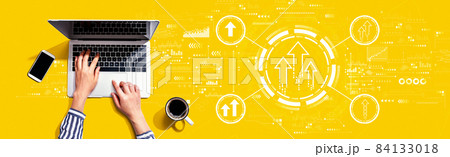 Rising arrow theme with person using laptop 84133018