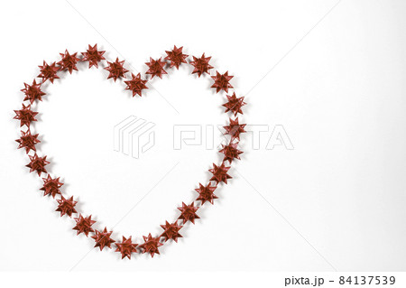 Red Floding paper stars on white background. on the left 84137539