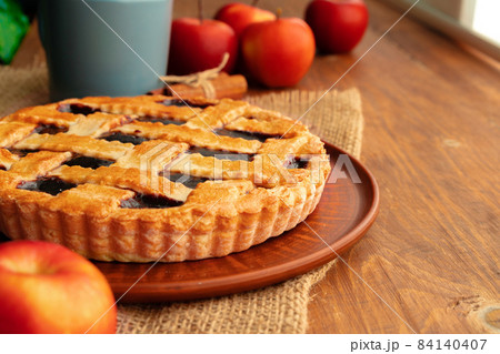 Close up of homemade traditional sweet autumn raspberry tart pie on wooden table 84140407