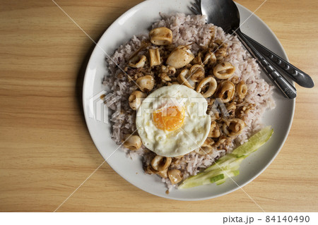 Khao Pad Ka Prao Pla Muek Kai Dao, thai food style Khao Pad Ka Prao Pla Muek Kai Dao, thai food style 84140490