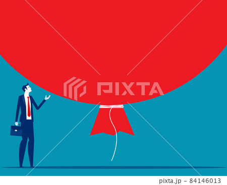 Investor standing under huge big air balloon bubble. Risk of speculation investment Investor standing under huge big air balloon bubble. Risk of speculation investment 84146013