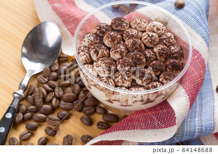 Tiramisu dessert in a glass cup on wooden table 84148688