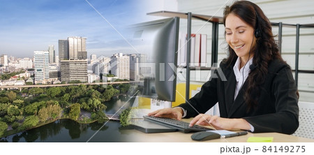 Business people wearing headset working in office broaden view Business people wearing headset working in office broaden view 84149275