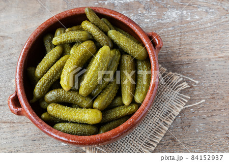 Pickled gherkins on rustic background Pickled gherkins on rustic background 84152937
