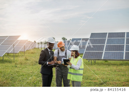 Multiracial people having discussion about green energy Multiracial people having discussion about green energy 84155416
