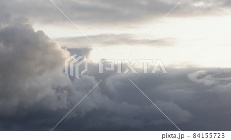 Slow motion birds flying in front of cloudscape with sunset light Slow motion birds flying in front of cloudscape with sunset light 84155723
