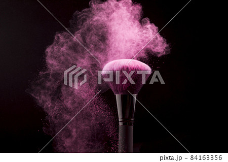 cosmetic brush cloud pink powder dark background. High quality beautiful photo concept cosmetic brush cloud pink powder dark background. High quality beautiful photo concept 84163356
