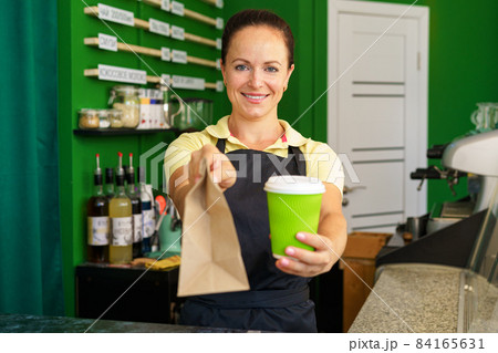 Portrait of a woman barista in coffee shop 84165631
