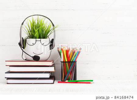 Home office with supplies and plant 84168474