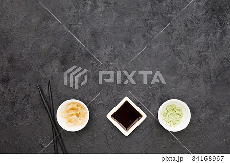 overhead view marinated ginger wasabi soya sauce with chopstick blackboard. High quality beautiful photo concept overhead view marinated ginger wasabi soya sauce with chopstick blackboard. High quality beautiful photo concept 84168967