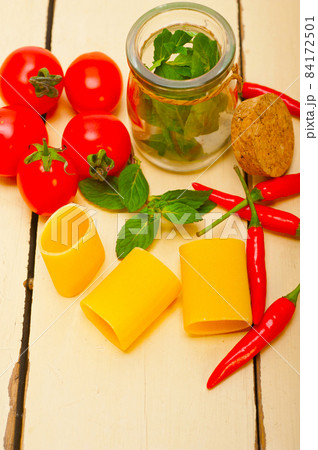 Italian pasta paccheri with tomato mint and chili pepper Italian pasta paccheri with tomato mint and chili pepper 84172501