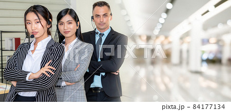 Business people wearing headset working in office broaden view 84177134
