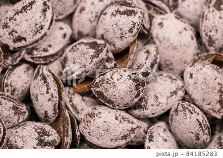 Salted apricot kernels close-up. Selling diet products in the store. Salted apricot kernels close-up. Selling diet products in the store. 84185283