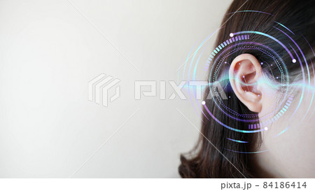 Ear of young woman with sound waves simulation technology. Concept of hearing test, hearing aids, ear disorders and health care. 84186414