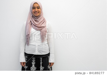 Arab female Muslim in traditional hijab clothes for praying namaz. Selective Focus  84189277