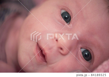 One month newborn baby sleeping in bed 84189325