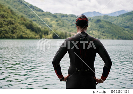 triathlete swimmer portrait wearing wetsuit on training triathlete swimmer portrait wearing wetsuit on training 84189432