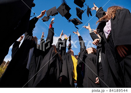 Group of diverse international graduating students celebrating 84189544
