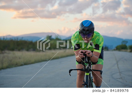triathlon athlete riding a bike 84189976