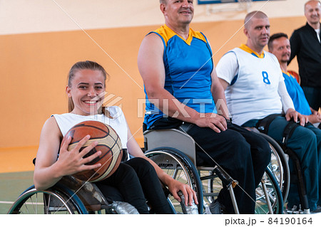 a photo of basketball teams with disabilities with the selector in the big hall before the start of the basketball game a photo of basketball teams with disabilities with the selector in the big hall before the start of the basketball game 84190164