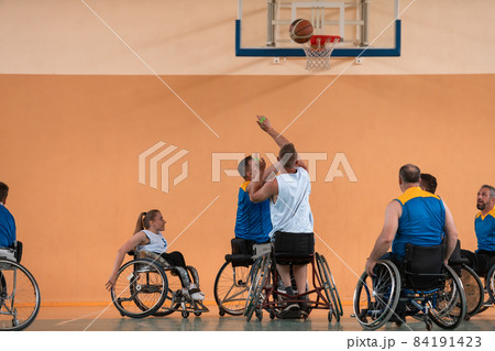 a photo of basketball teams with disabilities with the selector in the big hall before the start of the basketball game 84191423
