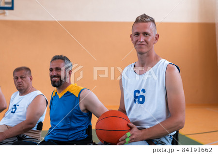 a photo of a basketball team of people with disabilities with professional sports equipment for people with disabilities on the basketball court a photo of a basketball team of people with disabilities with professional sports equipment for people with disabilities on the basketball court 84191662