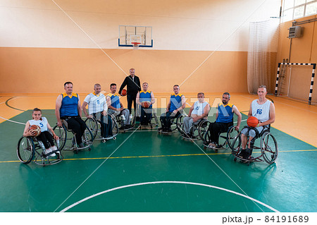 a photo of basketball teams with disabilities with the selector in the big hall before the start of the basketball game 84191689