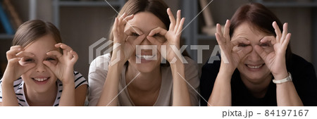 Portrait of happy three generations of women making funny faces 84197167
