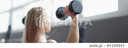 Sporty girl showing well trained body closeup Sporty girl showing well trained body closeup 84199945