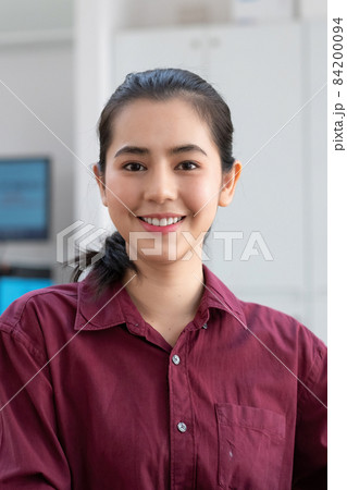 Portrait asian woman looking at camera smiling with confident and positive lifestyle. 84200094
