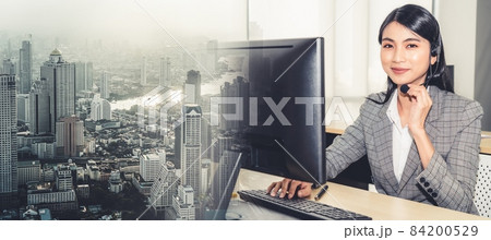 Business people wearing headset working in office broaden view 84200529