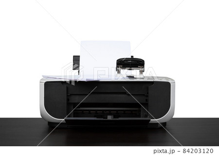 Laser home printer on table against white backgorund Laser home printer on table against white backgorund 84203120