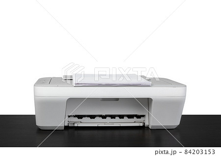 Laser home printer on table against white backgorund 84203153