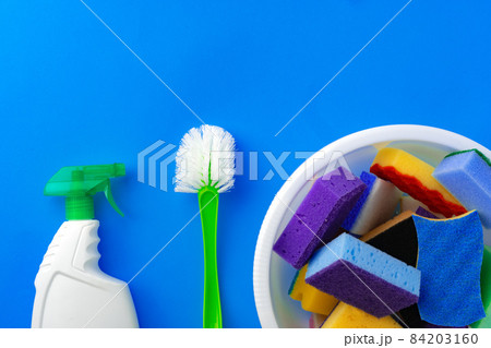House cleaning supplies on blue color background House cleaning supplies on blue color background 84203160