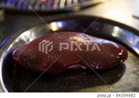 Grilled pork kidneys on charcoal fire, Korean traditional food 84204062