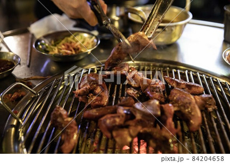 Grilled beef kidneys on charcoal fire, Korean traditional food 84204658