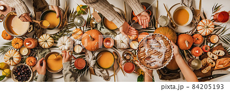 People eating over fall festive table set, top 84205193