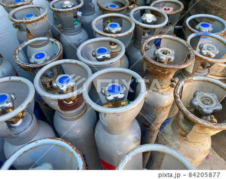 Many large metal, aluminum oxygen cylinders for breathing and diving stand on special stands on board a boat, ship, cruise liner Many large metal, aluminum oxygen cylinders for breathing and diving stand on special stands on board a boat, ship, cruise liner 84205877