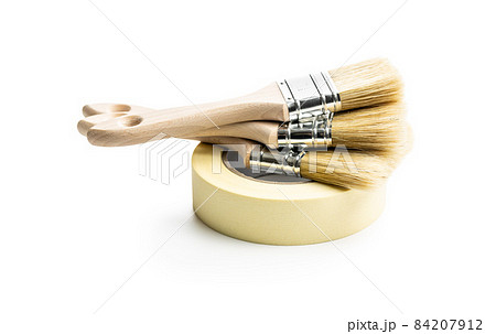 Set of clean paint brushes and paper tape 84207912