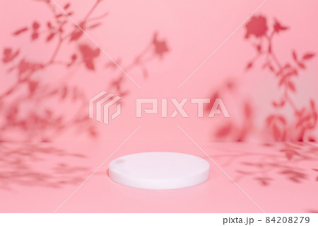 scene with circle podium on pink background and shadows scene with circle podium on pink background and shadows 84208279