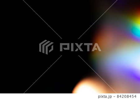 colorful rainbow crystal light leaks on black background 84208454