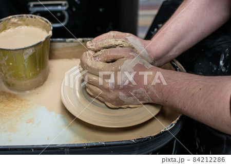 Clay modeling training on a potters wheel, clay master class. Art, creativity. Modeling clay, cultural traditions, hobby 84212286