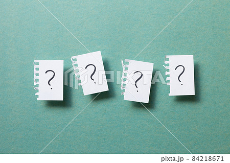 Question mark on ripped note on green background. Thinking, solution, business, idea concept 84218671