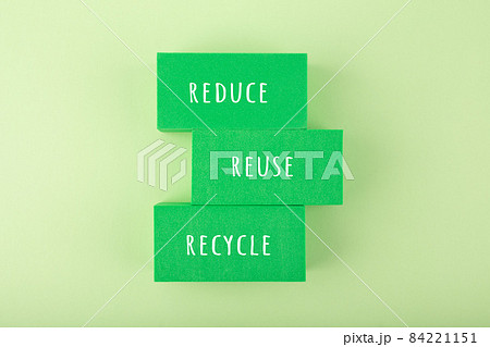 Modern composition with reduce, reuse, recycle inscription against light green background 84221151