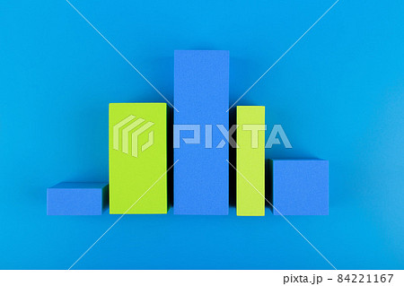 Business graph diagram or performance chart with blue and green bars with rise and fall dynamic against blue background 84221167